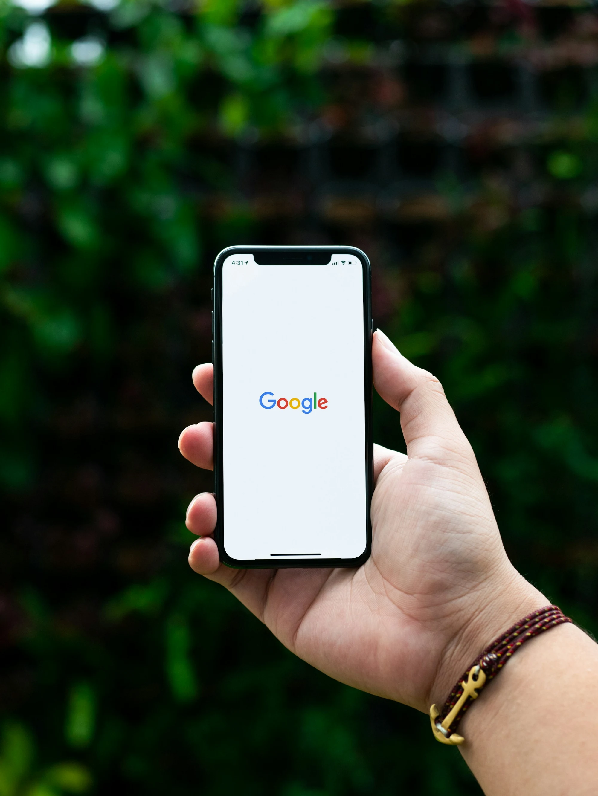 A hand holding a smartphone