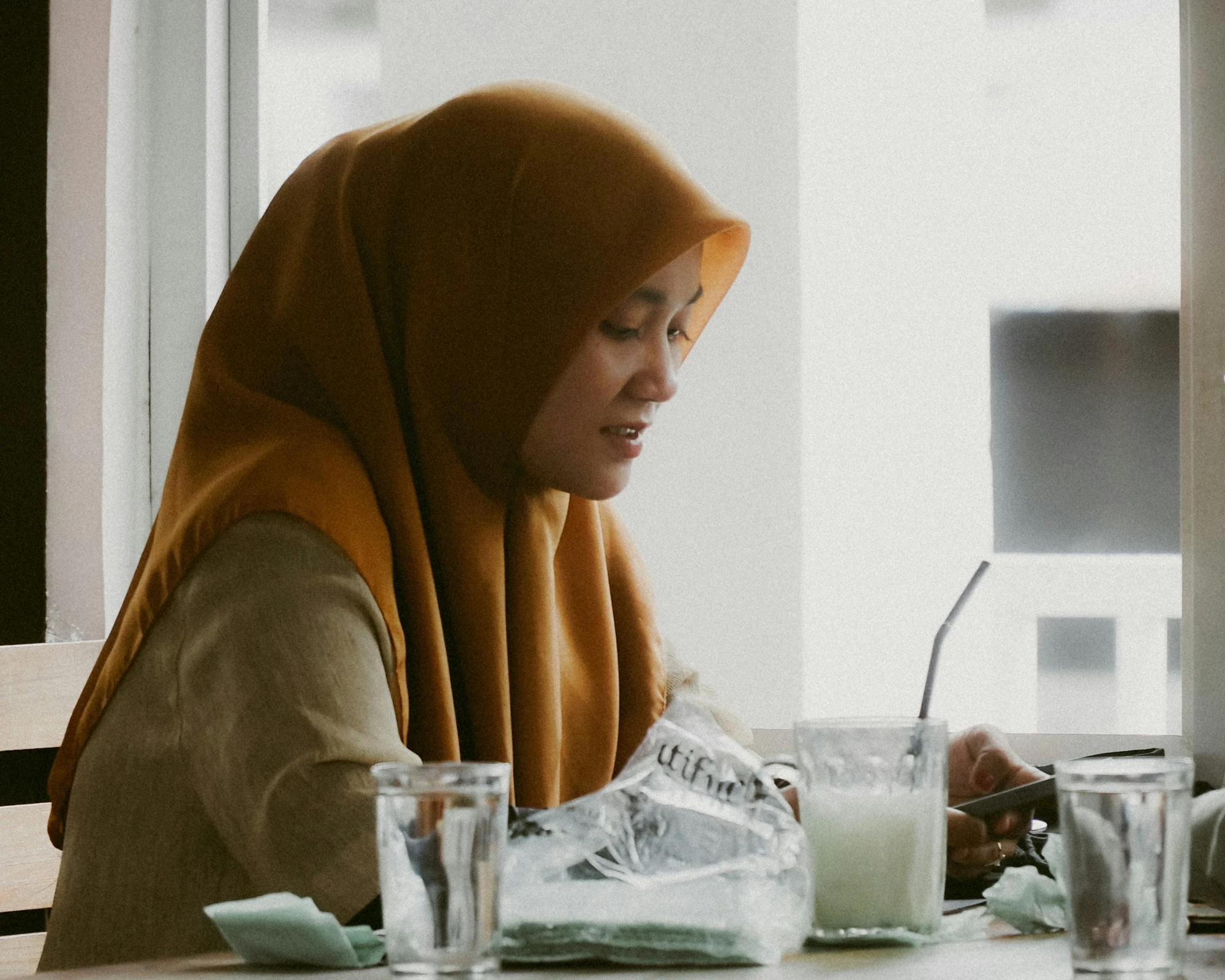 A web designer building an online store at her desk