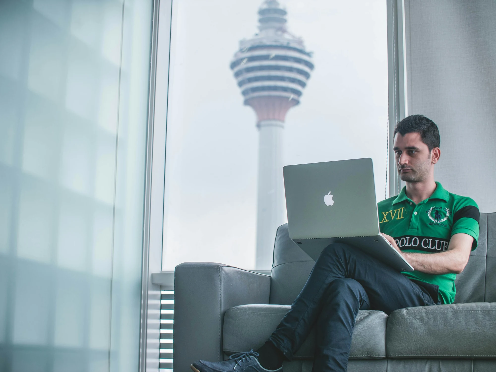 A professional at work with a view of Kuala Lumpur