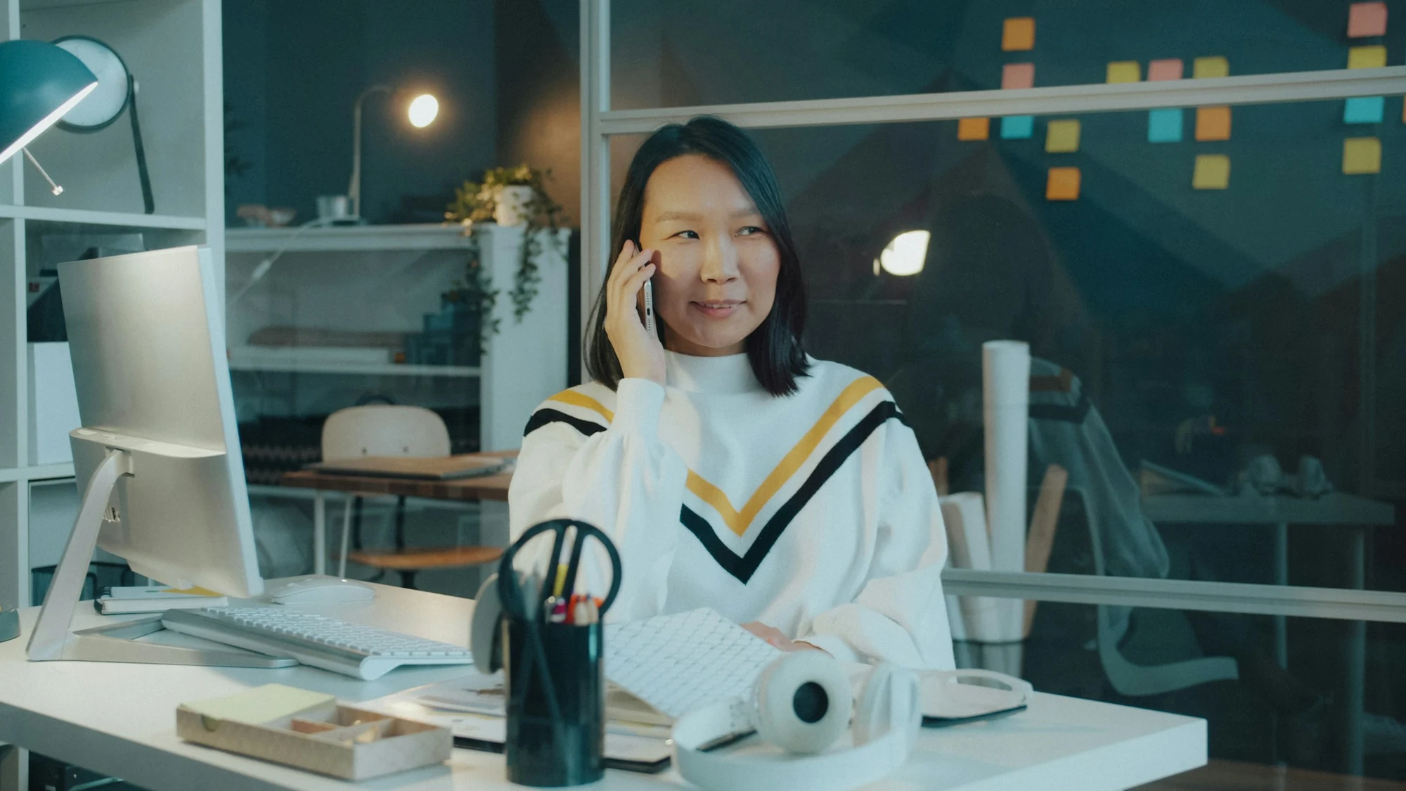 A team member on a call at her desk