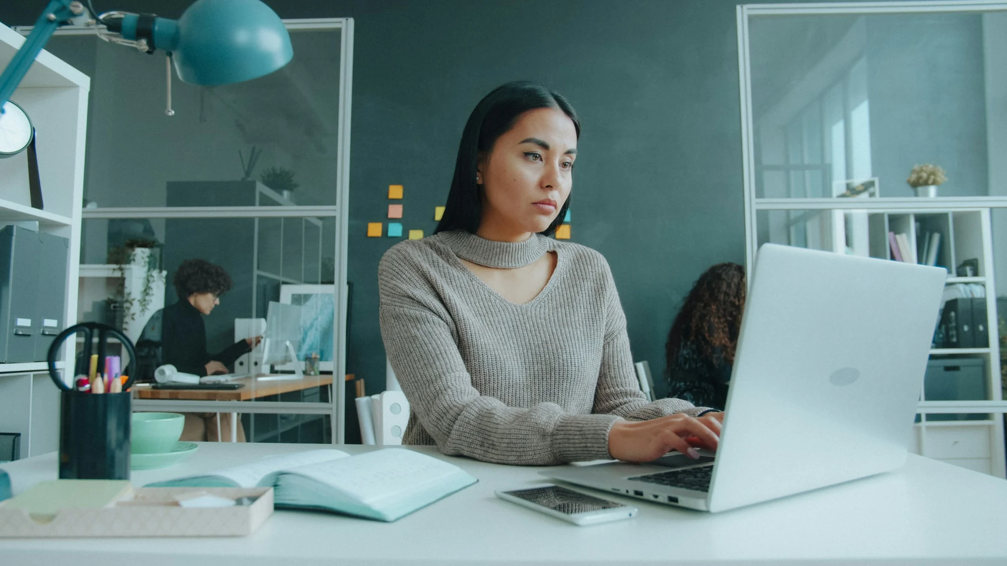 A professional working on a laptop