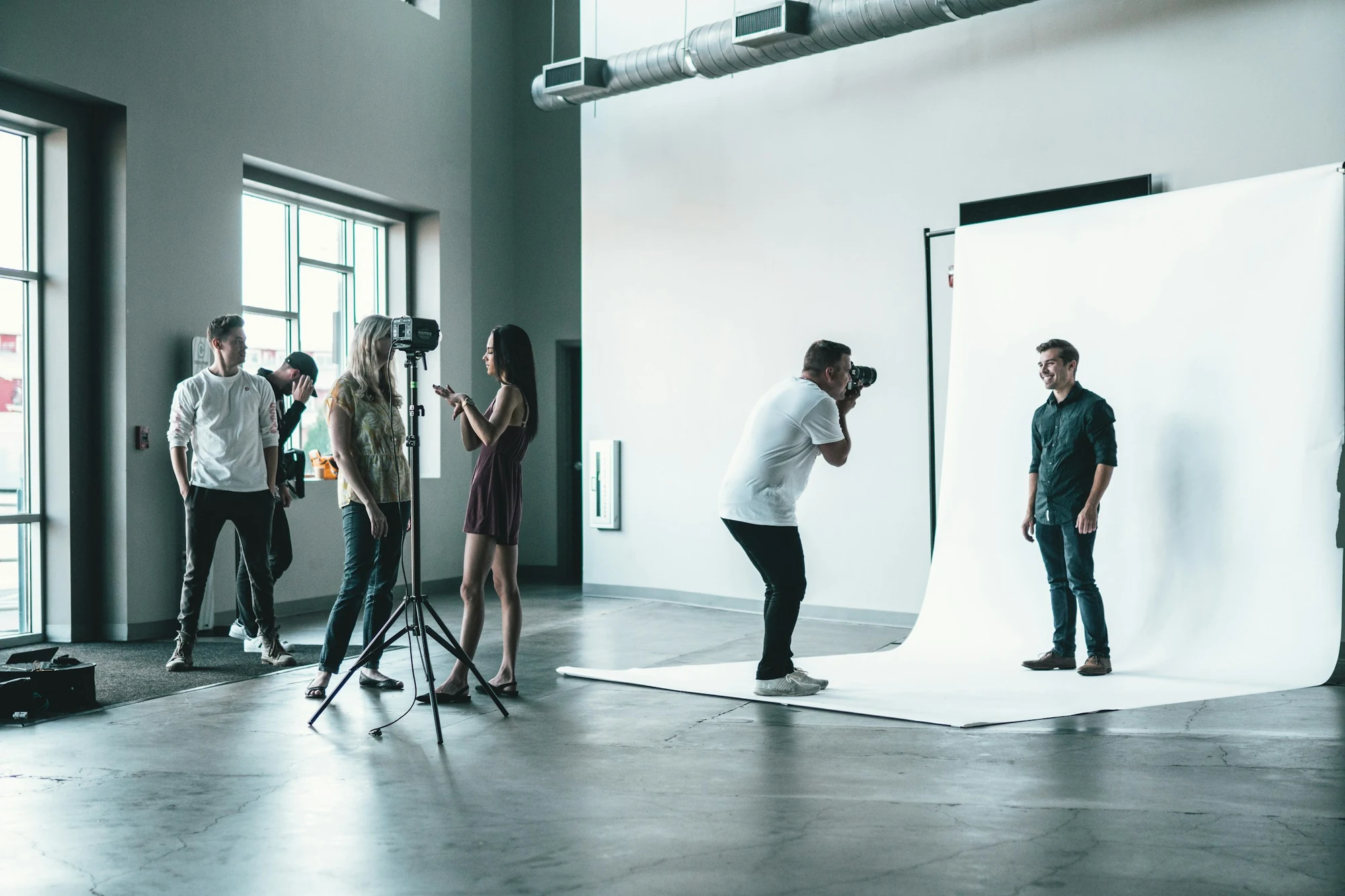 A creative team on set during a studio photo shoot